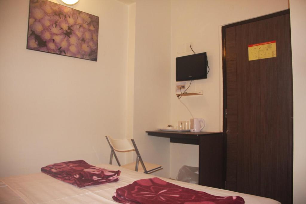 Down Town Guest House Calcutta Værelse billede
